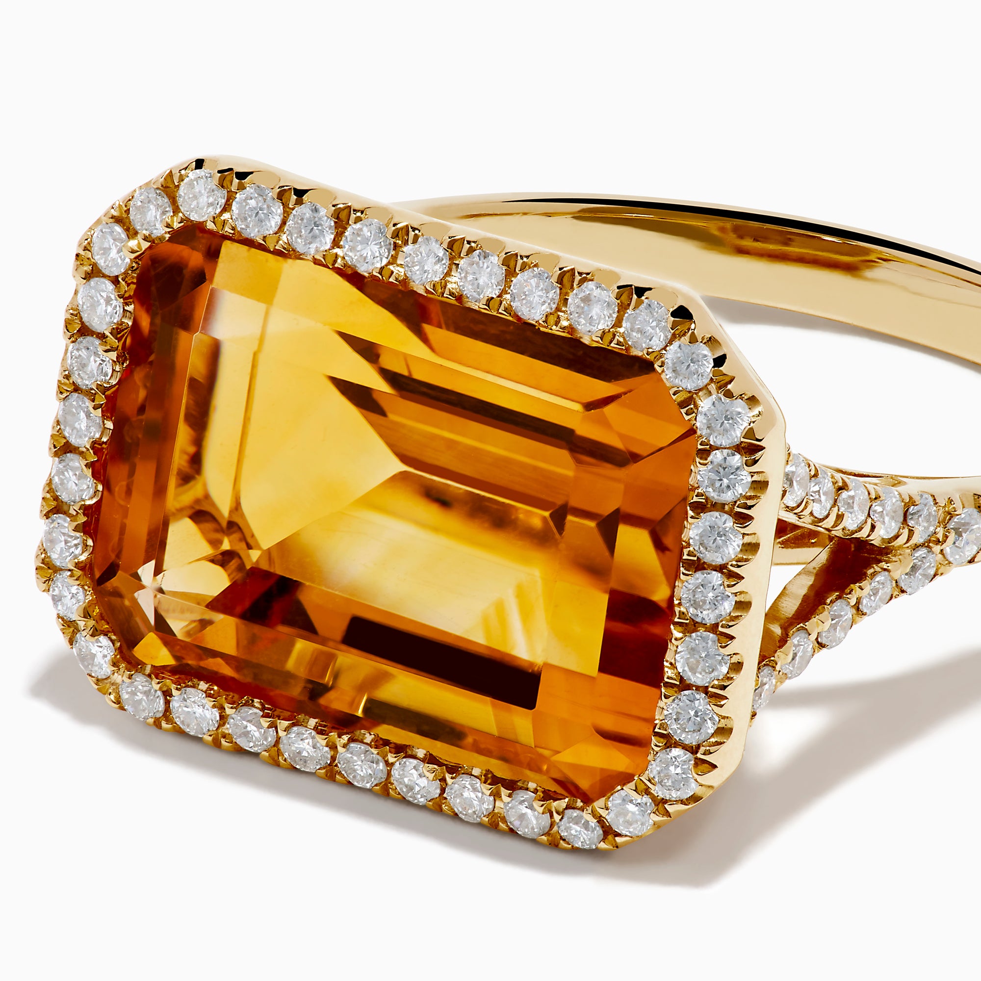 The 14K Yellow Gold Citrine and Diamond Halo East West Cocktail Ring showcases a large rectangular citrine gemstone with a diamond halo on a simple gold band, photographed against a white background.
