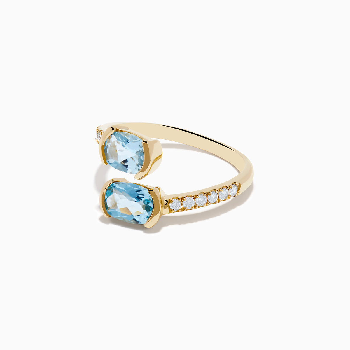 The Aquarius 14K Yellow Gold Aquamarine and Diamond Bypass Ring showcases two square-cut aquamarines facing each other, with sparkling round diamonds accenting one side of the band.