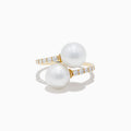 The 14K Yellow Gold Fresh Water Pearl and Diamond Bypass Ring features two large pearls at each end and a diamond-lined band for an open-ended, elegant look.