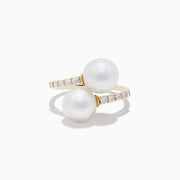 The 14K Yellow Gold Fresh Water Pearl and Diamond Bypass Ring features two large pearls at each end and a diamond-lined band for an open-ended, elegant look.