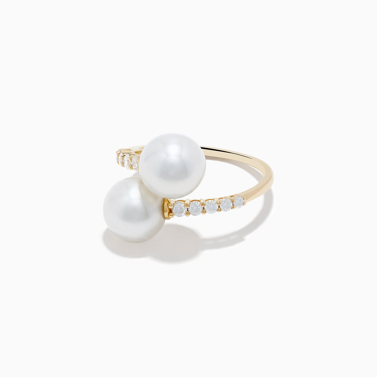 The 14K Yellow Gold Fresh Water Pearl and Diamond Bypass Ring features two large pearls at each end and a diamond-lined band for an open-ended, elegant look.