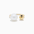 The 14K Yellow Gold Fresh Water Pearl and Bead Open Ring features a gleaming pearl on one end and a polished gold bead on the other, all showcased against a white background.