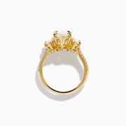 The Lab Grown Marquise Diamond 3 Stone Ring in 14K Yellow Gold features a central lab-grown marquise diamond, flanked by two pear-shaped diamonds with additional smaller stones adorning the band, shown on a white background.