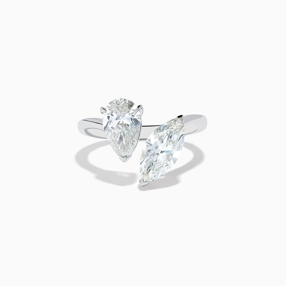 The Lab Grown Diamond Toi Et Moi Ring in 14K White Gold features two striking clear diamonds—a pear-shaped and a marquise-cut—set on open ends of the band, shown against a plain white background.