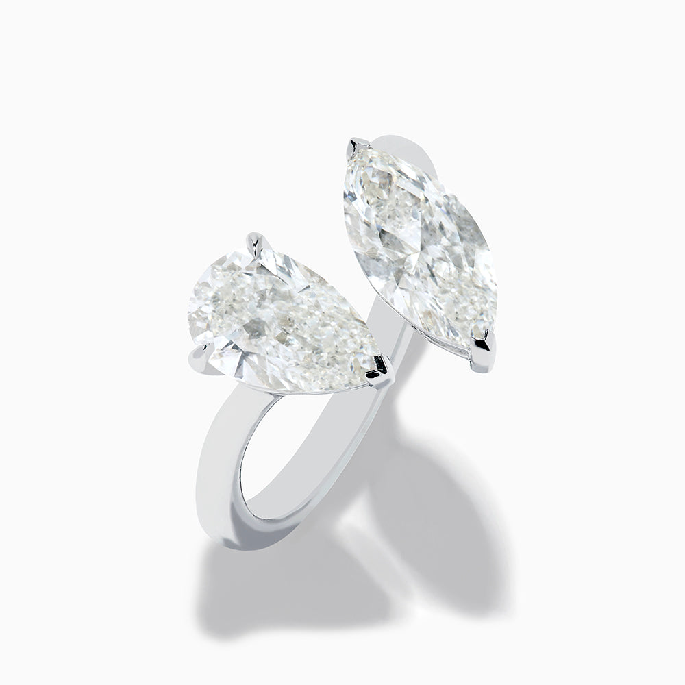 The Lab Grown Diamond Toi Et Moi Ring in 14K White Gold features two striking clear diamonds—a pear-shaped and a marquise-cut—set on open ends of the band, shown against a plain white background.