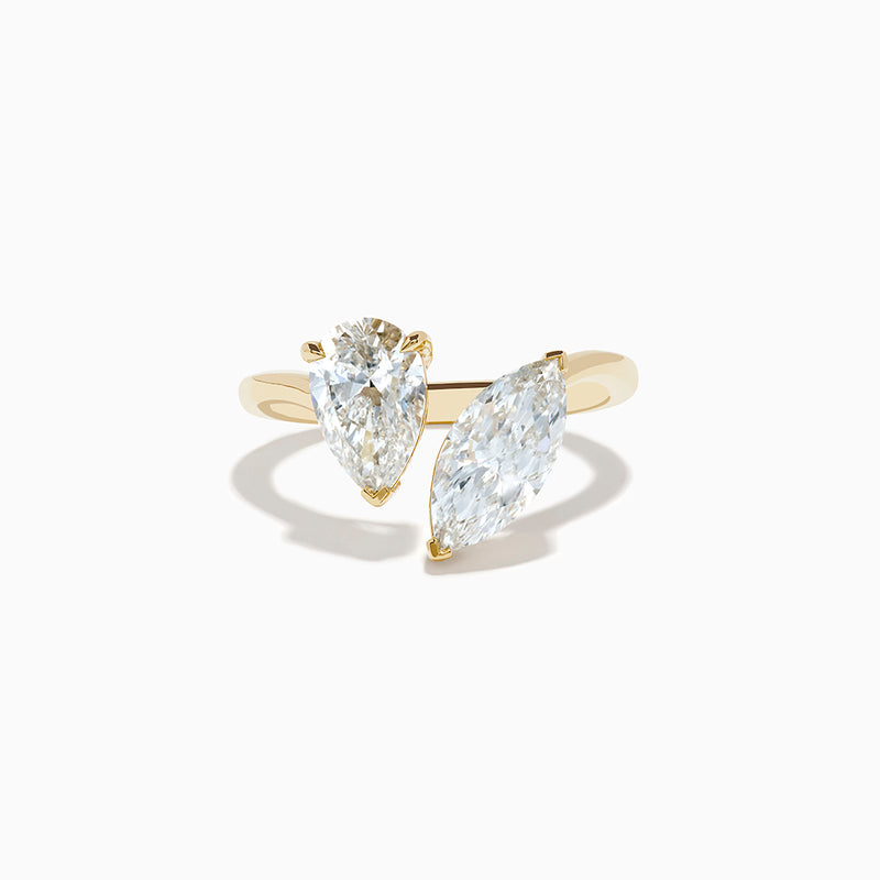 The Lab Grown Diamond Toi Et Moi Ring in 14K Yellow Gold features pear-shaped and marquise-cut lab diamonds set side by side, shown against a white background.
