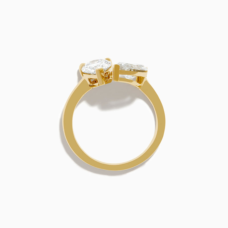The Lab Grown Diamond Toi Et Moi Ring in 14K Yellow Gold features pear-shaped and marquise-cut lab diamonds set side by side, shown against a white background.