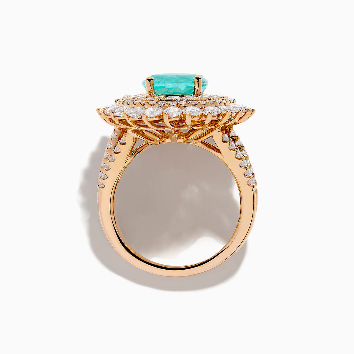 The Effy Hematian 18K Rose Gold Paraiba and Diamond Ring features an oval turquoise center stone, surrounded by sparkling round white diamonds in a double halo design, set against a white background.