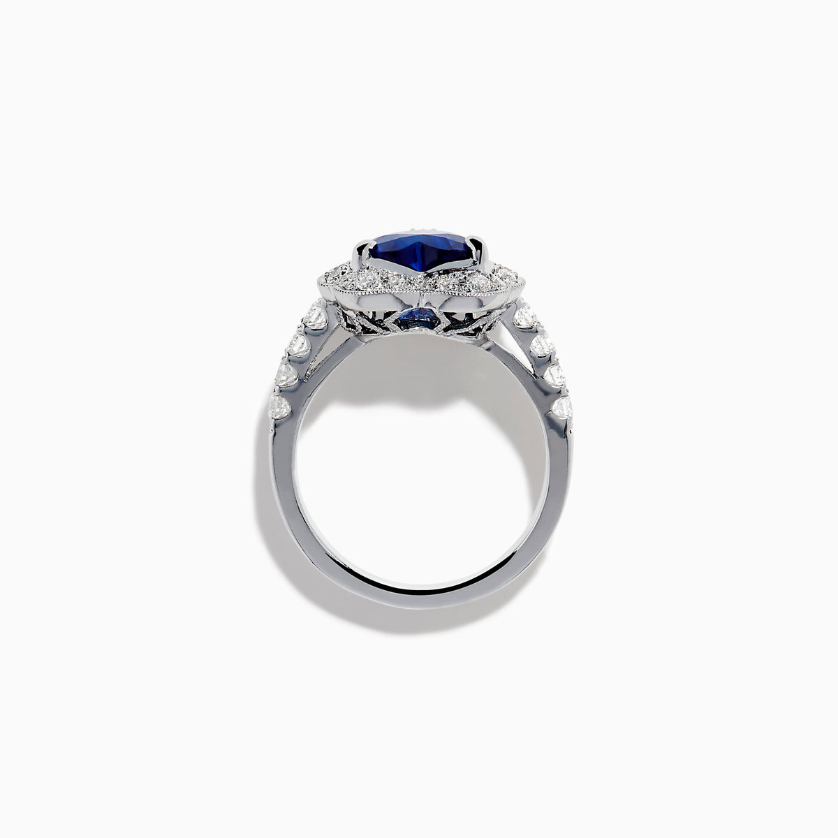 The Effy Hematian 18K White Gold Heart Shaped Blue Sapphire and Diamond Halo Ring features a heart-shaped blue sapphire center stone, a diamond halo, and additional diamonds along the band.