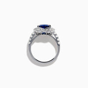 The Effy Hematian 18K White Gold Heart Shaped Blue Sapphire and Diamond Halo Ring features a heart-shaped blue sapphire center stone, a diamond halo, and additional diamonds along the band.