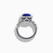 The Effy Hematian 18K White Gold Tanzanite and Diamond Halo Ring showcases a large rectangular blue tanzanite at the center, encircled by a diamond halo with additional diamonds set along the band.
