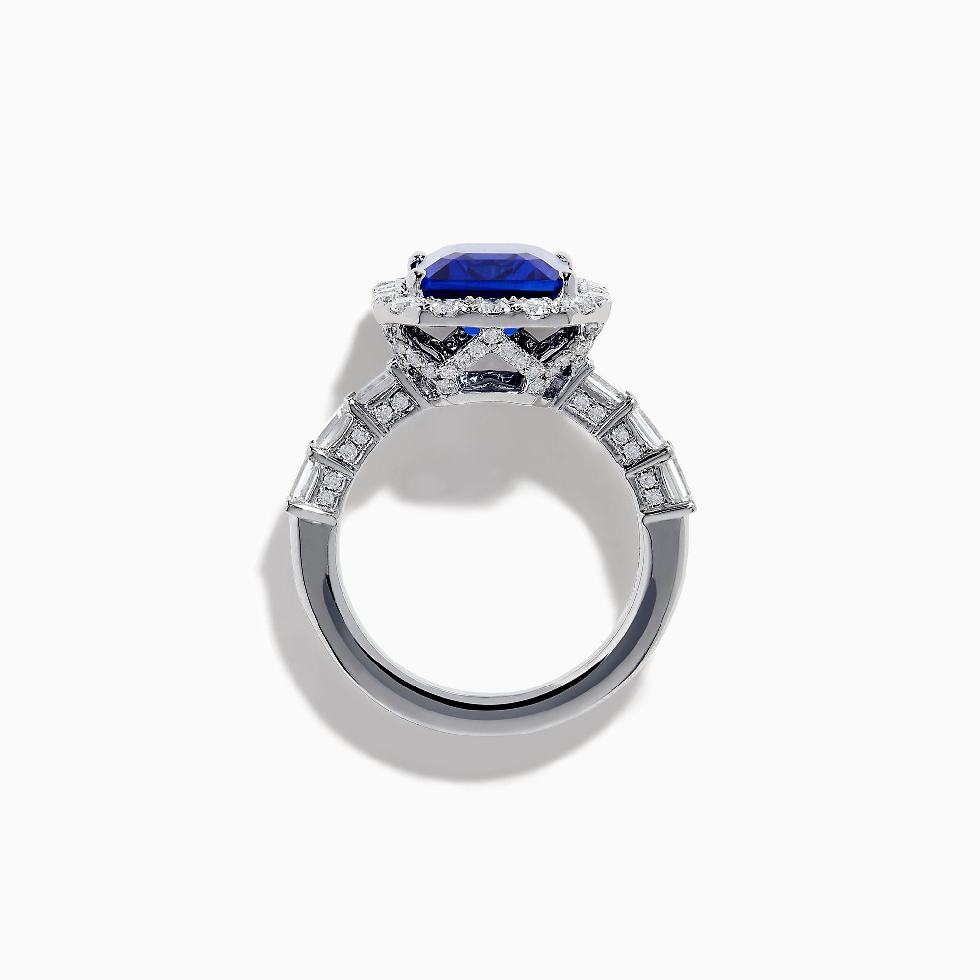 The Effy Hematian 18K White Gold Tanzanite and Diamond Halo Ring showcases a large rectangular blue tanzanite at the center, encircled by a diamond halo with additional diamonds set along the band.