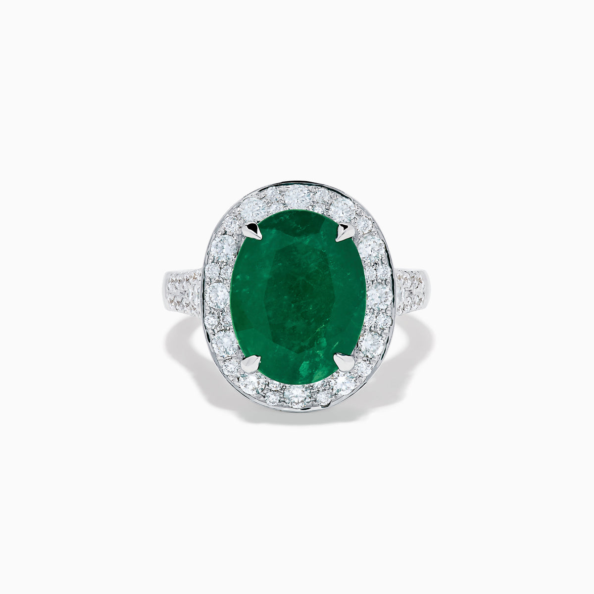 The Effy Hematian 18K White Gold Oval Emerald and Diamond Halo Ring is displayed against a pristine white background.