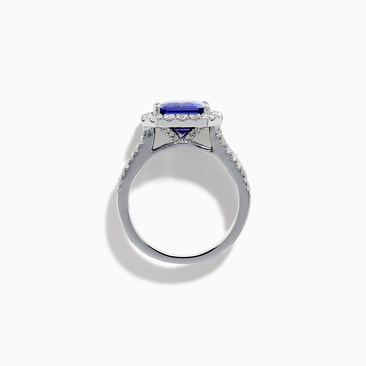 The Effy Hematian 18K White Gold Tanzanite and Diamond Halo Cocktail Ring is shown from the front, featuring an emerald-cut blue tanzanite with a diamond halo and diamond-accented band against a white background.