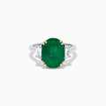 The Effy Hematian 14K Two Tone Gold Emerald and Diamond Three-Stone Ring features a large oval emerald center set with four gold prongs, flanked by two clear rectangular diamonds on a gold and silver band.