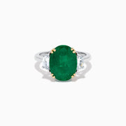 The Effy Hematian 14K Two Tone Gold Emerald and Diamond Three-Stone Ring features a large oval emerald center set with four gold prongs, flanked by two clear rectangular diamonds on a gold and silver band.