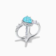 The Effy Hematian 14K White Gold Paraiba and Diamond Criss Cross Ring features a stunning pear-shaped Paraiba gemstone at its center with sparkling diamonds, all set on an elegant split shank band against a white background.