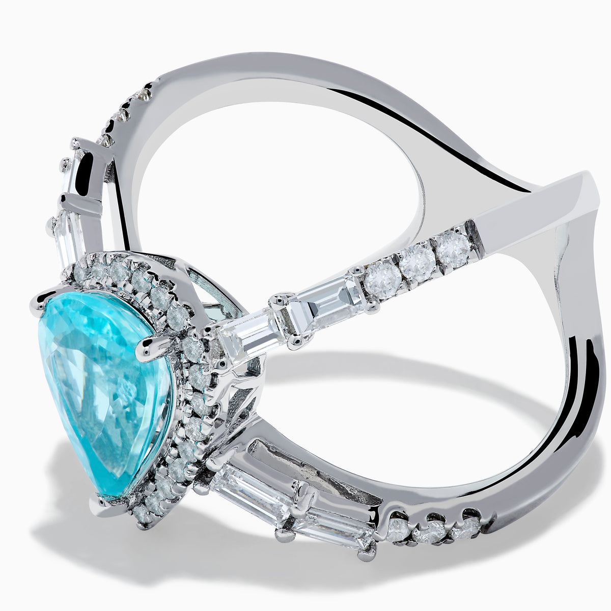 The Effy Hematian 14K White Gold Paraiba and Diamond Criss Cross Ring features a stunning pear-shaped Paraiba gemstone at its center with sparkling diamonds, all set on an elegant split shank band against a white background.