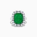 The Brasilica 14K White Gold Emerald and Diamond Ring features a large rectangular emerald center, surrounded by a halo of round and baguette-cut white diamonds, set on sleek 14K white gold.