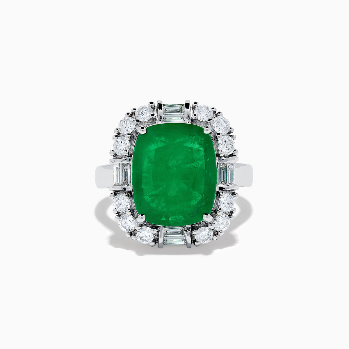 The Brasilica 14K White Gold Emerald and Diamond Ring features a large rectangular emerald center, surrounded by a halo of round and baguette-cut white diamonds, set on sleek 14K white gold.