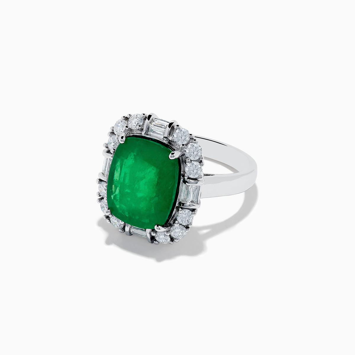 The Brasilica 14K White Gold Emerald and Diamond Ring features a large rectangular emerald center, surrounded by a halo of round and baguette-cut white diamonds, set on sleek 14K white gold.