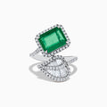 The Brasilica 14K White Gold Emerald and Diamond Leaf Ring features a large rectangular emerald, small diamond accents, and a diamond-encrusted leaf design on a split band.