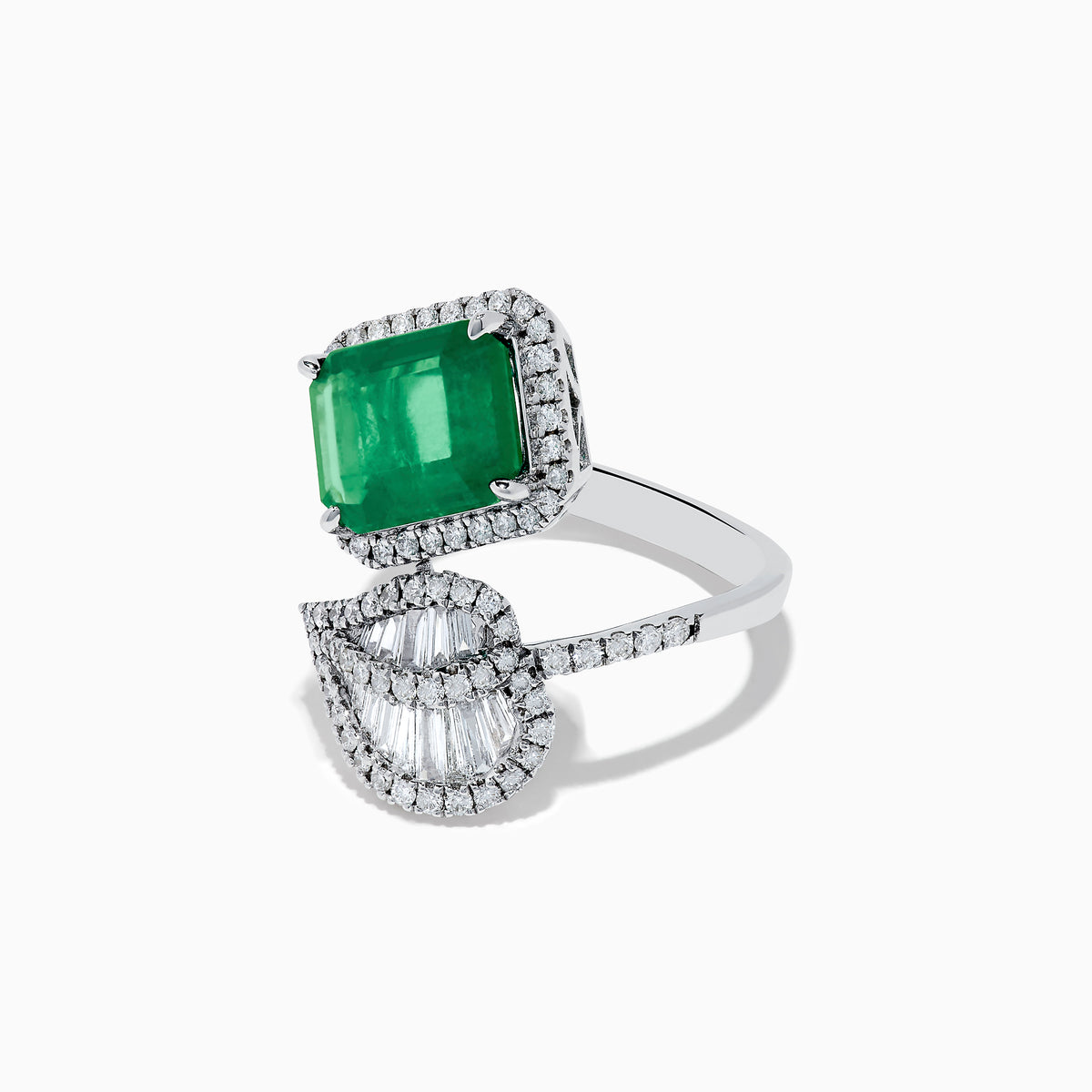 The Brasilica 14K White Gold Emerald and Diamond Leaf Ring features a large rectangular emerald, small diamond accents, and a diamond-encrusted leaf design on a split band.