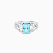 The Effy Hematian 18K White Gold Paraiba Tourmaline and Diamond Ring showcases a vibrant, large rectangular tourmaline center stone, flanked by two side diamonds and a band adorned with small round diamonds.