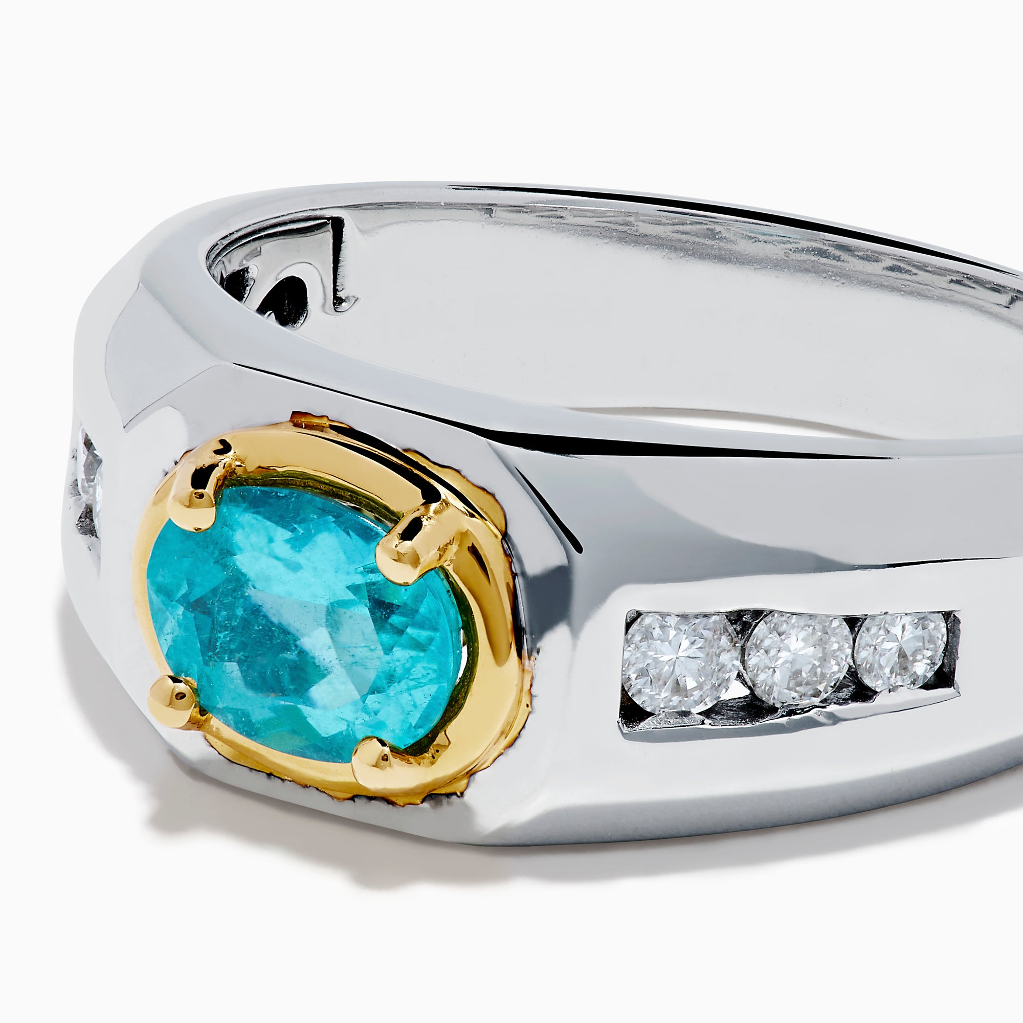 A mens 18K two tone GIA certified Paraiba and diamond ring featuring an oval Paraiba gemstone in a gold setting, accented by three diamonds on each side, displayed on a white background.