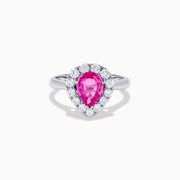 The 18K White Gold Pink Sapphire and Diamond Halo Ring features a pear-shaped pink sapphire center, accented by a sparkling diamond halo, elegantly displayed against a plain white background.