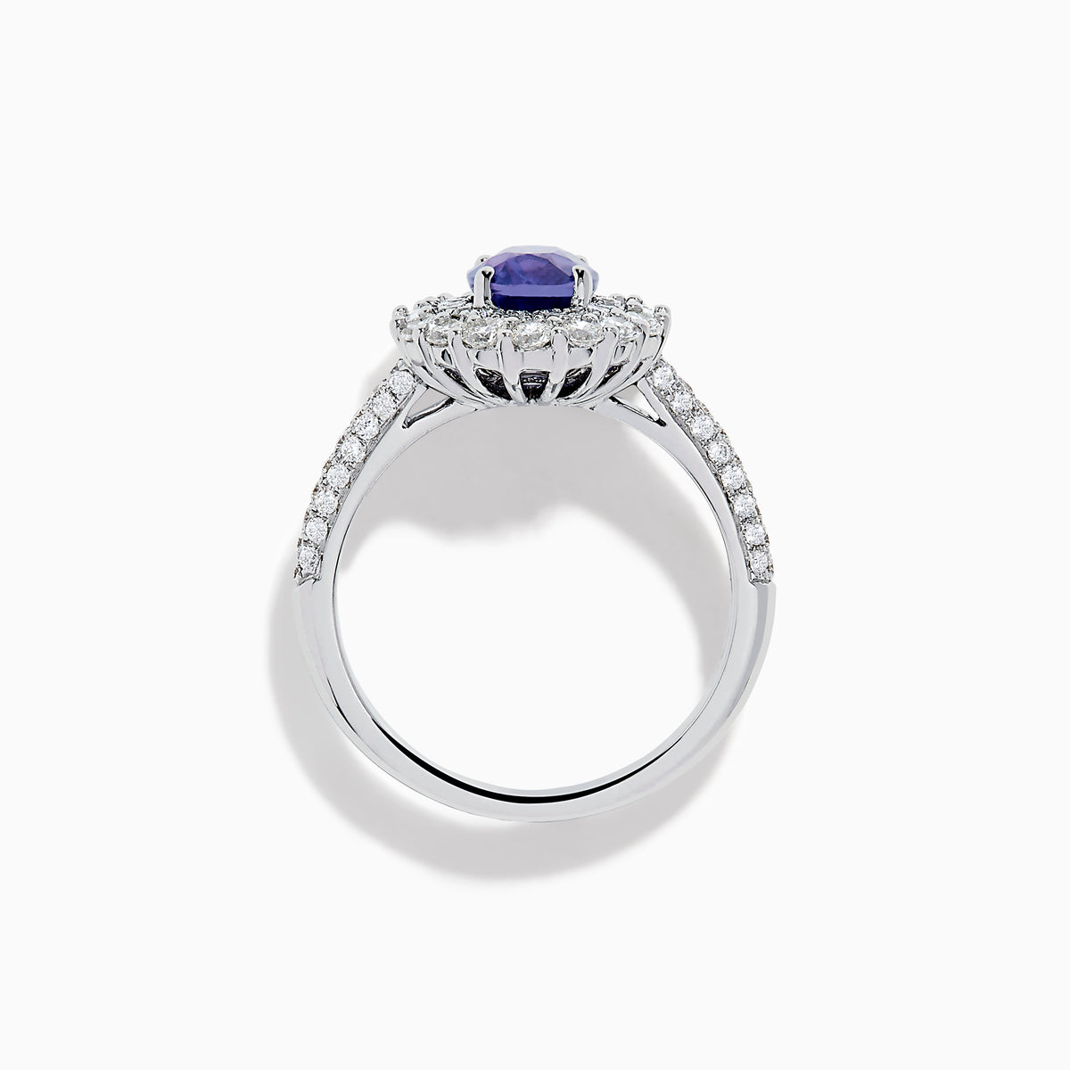 The 18K White Gold Purple Sapphire and Diamond Double Halo Ring features an oval purple sapphire center, two rows of white diamonds encircling it, and additional diamonds set along the band.