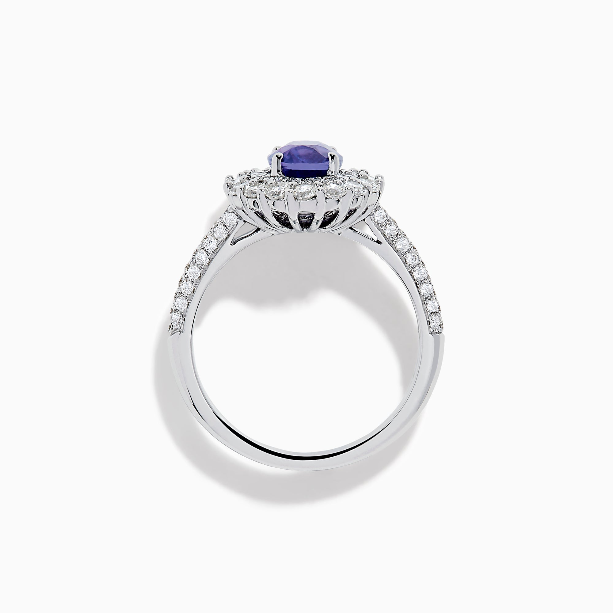 The 18K White Gold Purple Sapphire and Diamond Double Halo Ring features an oval purple sapphire center, two rows of white diamonds encircling it, and additional diamonds set along the band.