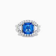 The Effy Hematian 18K Gold Cushion-Cut Blue Sapphire and Diamond Ring features a striking cushion-cut blue sapphire surrounded by a halo of round and baguette diamonds, all set in polished white 18K gold.