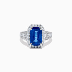 The Effy Hematian 18K Gold Elongated Cushion Blue Sapphire and Diamond Ring features a striking blue sapphire framed by round and baguette diamonds, with additional diamond accents along the split shank band.