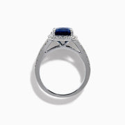 The Effy Hematian 18K Gold Elongated Cushion Blue Sapphire and Diamond Ring features a striking blue sapphire framed by round and baguette diamonds, with additional diamond accents along the split shank band.