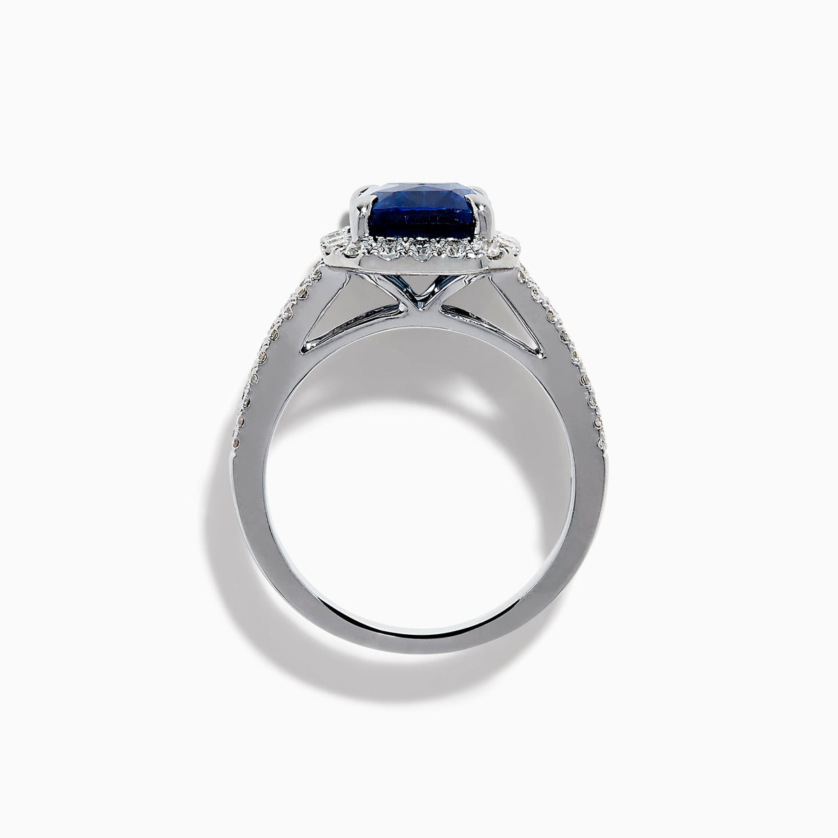 The Effy Hematian 18K Gold Elongated Cushion Blue Sapphire and Diamond Ring features a striking blue sapphire framed by round and baguette diamonds, with additional diamond accents along the split shank band.