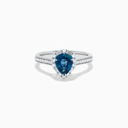 The Effy Hematian 18K White Gold Ring features a pear-shaped blue sapphire, surrounded by a halo of diamonds and set on a diamond-studded band, elegantly displayed against a white background.