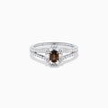 The Effy Hematian 18K White Gold Oval Alexandrite and Diamond Halo Ring features a central oval alexandrite surrounded by clear diamond accents in a halo and along the split shank band.