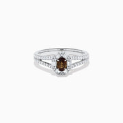 The Effy Hematian 18K White Gold Oval Alexandrite and Diamond Halo Ring features a central oval alexandrite surrounded by clear diamond accents in a halo and along the split shank band.