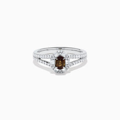 The Effy Hematian 18K White Gold Oval Alexandrite and Diamond Halo Ring features a central oval alexandrite surrounded by clear diamond accents in a halo and along the split shank band.