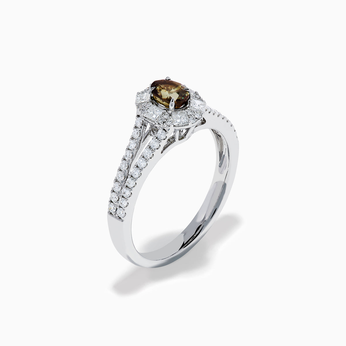 The Effy Hematian 18K White Gold Oval Alexandrite and Diamond Halo Ring features a central oval alexandrite surrounded by clear diamond accents in a halo and along the split shank band.