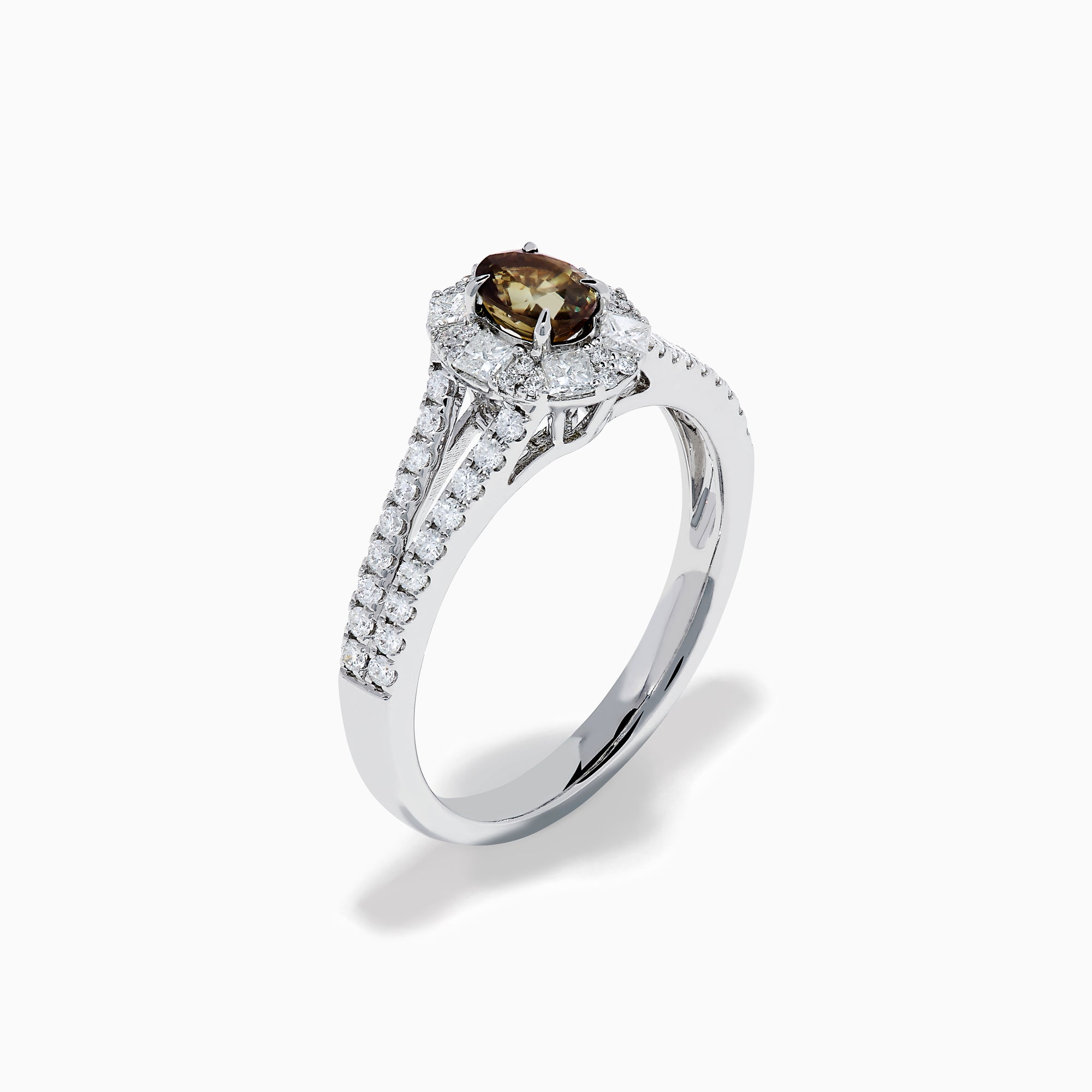 The Effy Hematian 18K White Gold Oval Alexandrite and Diamond Halo Ring features a central oval alexandrite surrounded by clear diamond accents in a halo and along the split shank band.