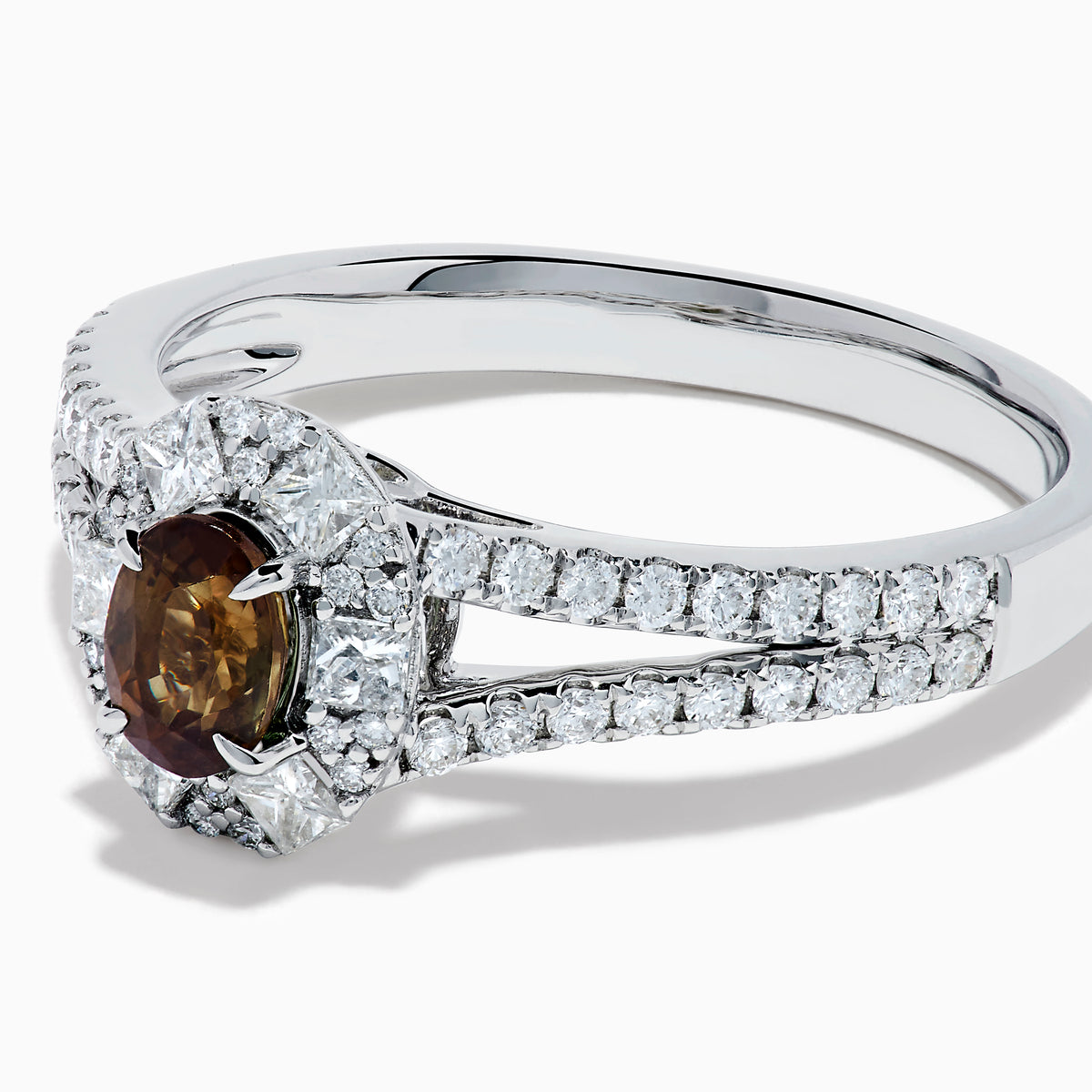 The Effy Hematian 18K White Gold Oval Alexandrite and Diamond Halo Ring features a central oval alexandrite surrounded by clear diamond accents in a halo and along the split shank band.