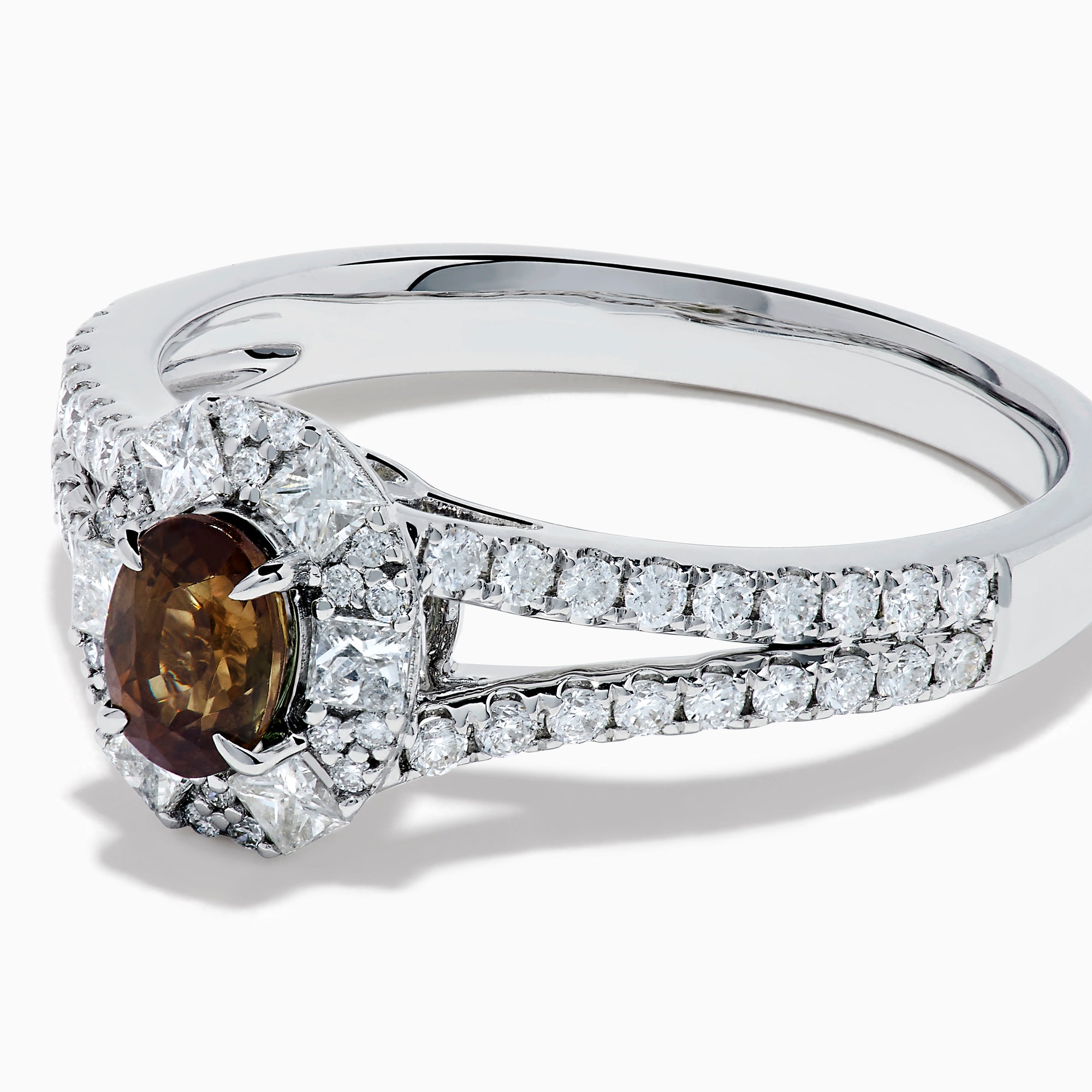 The Effy Hematian 18K White Gold Oval Alexandrite and Diamond Halo Ring features a central oval alexandrite surrounded by clear diamond accents in a halo and along the split shank band.
