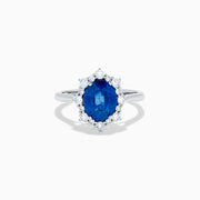 The Effy Hematian 14K White Gold Blue Sapphire and Diamond Halo Ring showcases an oval blue sapphire center, surrounded by a halo of sparkling round white diamonds, presented against a white background.