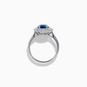 The Effy Hematian 14K White Gold Blue Sapphire and Diamond Halo Ring showcases an oval blue sapphire center, surrounded by a halo of sparkling round white diamonds, presented against a white background.