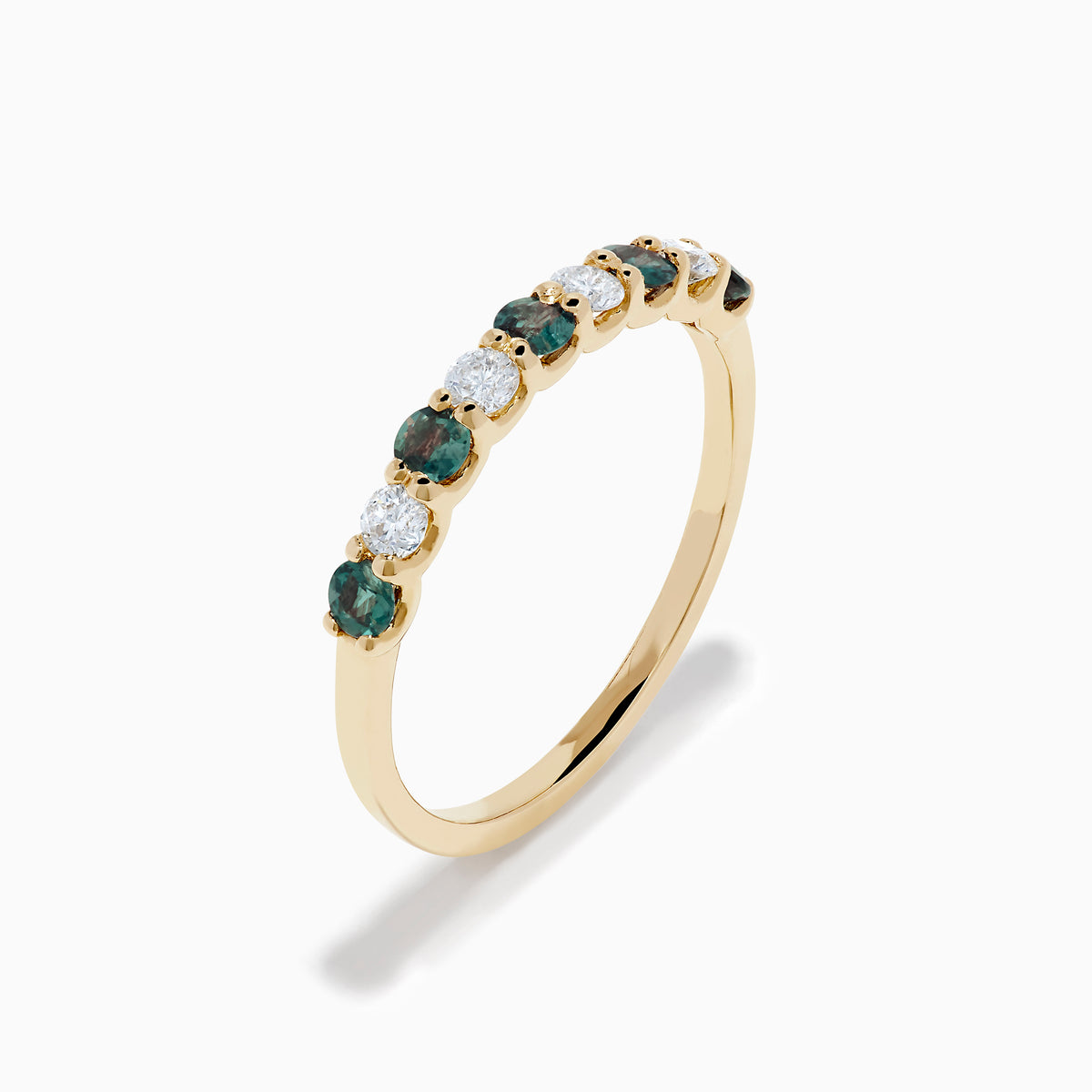 The Effy Hematian 14K Yellow Gold 9-Stone Ring features alternating round white diamonds and green alexandrites set in a row along the band, shown on a white background.