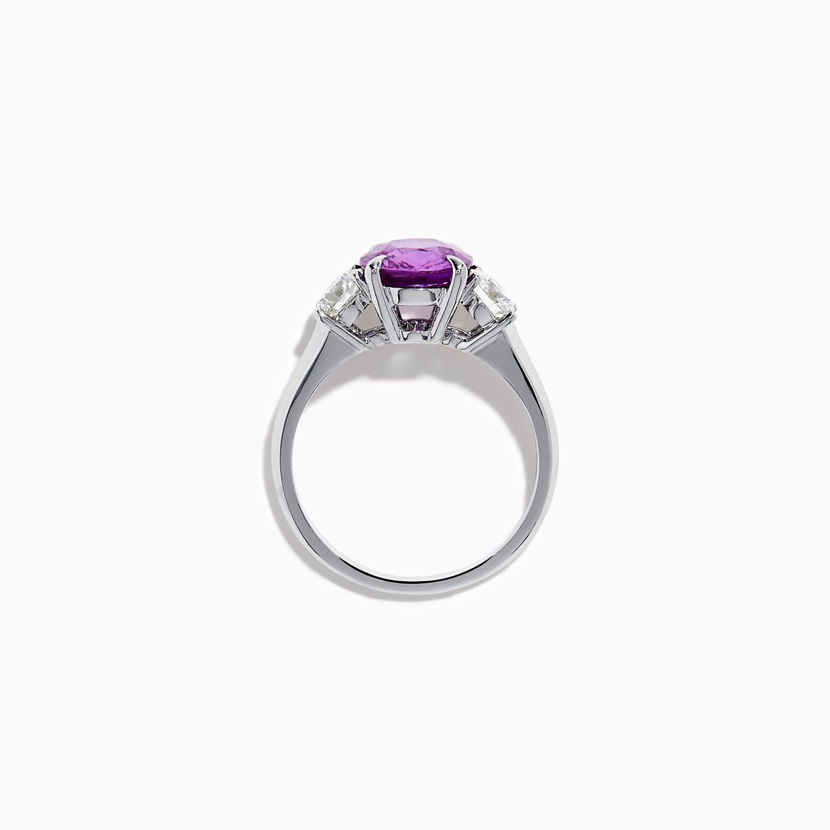 The Effy Hematian 18K White Gold Purple Sapphire and Diamond Three-Stone Ring features a large oval purple sapphire at the center with two smaller diamonds, shown on a white background.