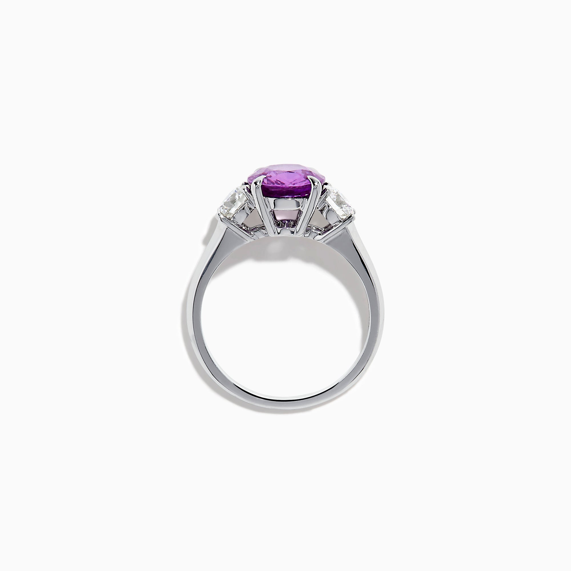 The Effy Hematian 18K White Gold Purple Sapphire and Diamond Three-Stone Ring features a large oval purple sapphire at the center with two smaller diamonds, shown on a white background.
