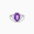 The Effy Hematian 18K White Gold Oval Purple Sapphire and Diamond Halo Ring features a central oval purple sapphire, two oval white diamonds, and smaller diamonds along the band, displayed on a white background.